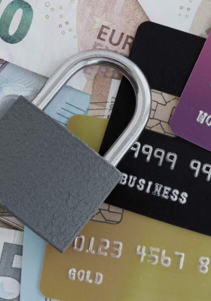 A padlock resting on banknotes and credit cards: the direct financial value of corporate email security